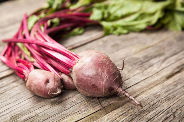 Fresh organic vegetables on wooden surface